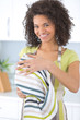 © auremar - portrait of young woman drying dishes