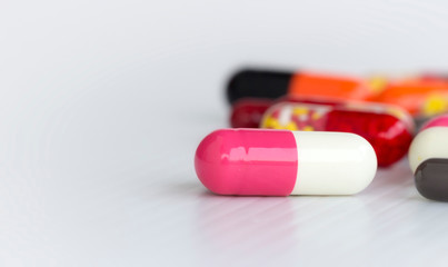 medicine concept; Assorted pharmaceutical medicine pills, tablets and capsules over white background.