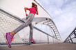 © ivanko80 - Young woman running over the bridge