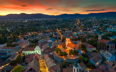 Wall Mural - Europe, Hungary, Szentendre Cityscape with churches in sunset. Amazing aerial photo, stunning lights