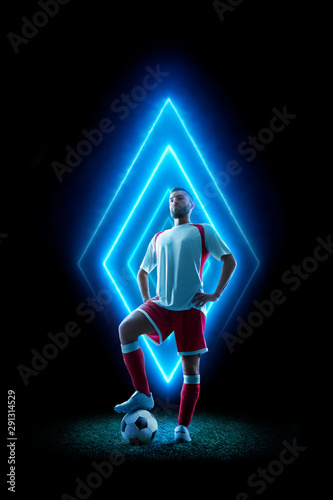 Professional soccer player in neon background Tableau sur Toile