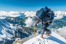 Extreme Alpinist In High Altitude On Aiguille De Bionnassay Mountain Summit, Mont Blanc Massif, Chamonix, Alps, France, Europe