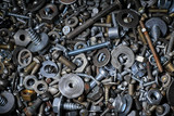 Fototapeta  - Abstract background with various screws, nuts, bolts and washers and other fasteners. Macro.