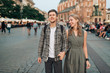 © benevolente - Young loving couple hugs at central square in Krakow (Cracow).