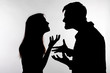 © satura_ - Aggression and abuse concept - man and woman expressing domestic violence in studio silhouette isolated on white background.