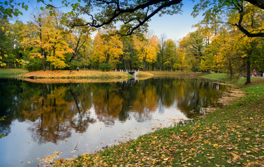 Wall Mural - bridge over the river in the autumn park