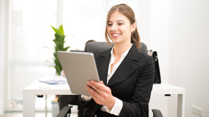 Wall Mural - Woman using a tablet