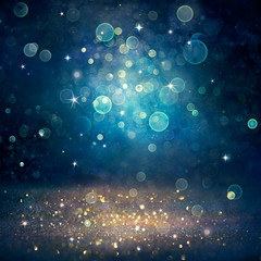 Wall Mural - christmas defocused - golden glitter dust on blue background