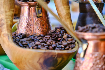 black coffee beans and arabic turk for his cooking, close up