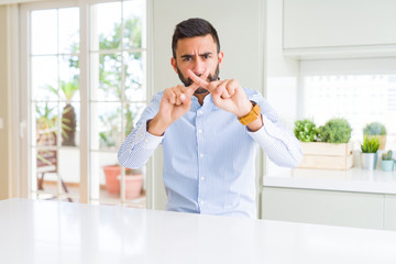 Poster - Handsome hispanic business man Rejection expression crossing fingers doing negative sign