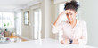 © Krakenimages.com - Wide angle of beautiful african american woman with afro hair worried and stressed about a problem with hand on forehead, nervous and anxious for crisis