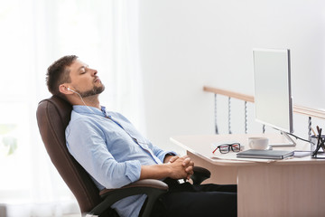 man having break during work in office