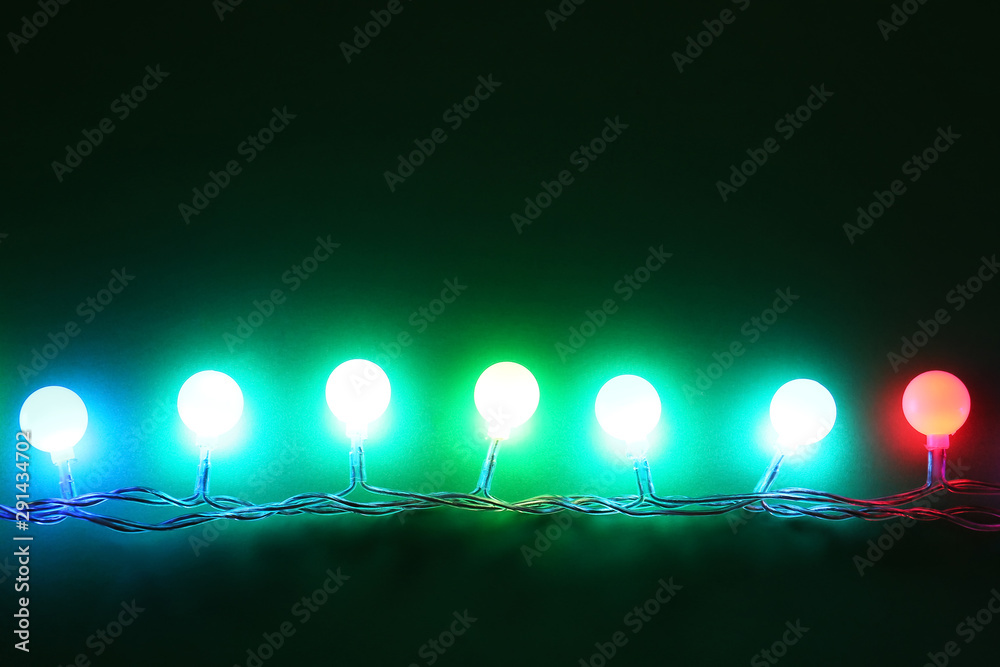 Beautiful Christmas lights on dark background