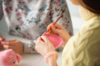 © nagaets - Young attractive girls in a knitting lesson