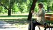 © motortion - Old blind man sitting on bench, thinking about life injustice feeling frustrated