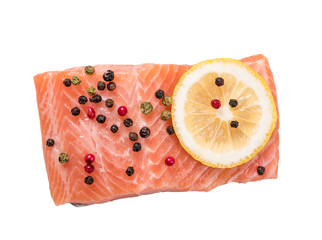 Steak of red fish, salmon with lemon, rosemary and thyme. Trout on white background.