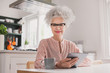 © ReeldealHD images - Portrait of senior adult female looking at digital tablet at home