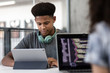© ReeldealHD images - African American male student coding in class