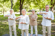 © Yakobchuk Olena - Smiling elderly people practicing qigong in the park