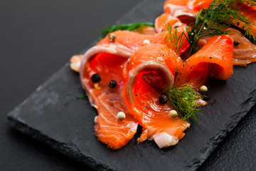 Smoked Salmon with peppercorns and dill close up