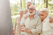 © Yakobchuk Olena - Happy mature people standing on the street