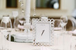 © Olga - White rectangular frame with number one - table number for guests at the wedding