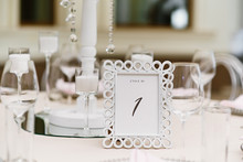White Rectangular Frame With Number One - Table Number For Guests At The Wedding