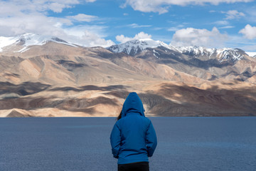 Landscape view of tourist woman enjoy with beautiful of Tso-moriri lake in Leh Ladakh, India