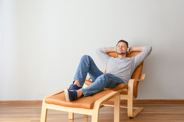 Wall Mural - Man with headphones relaxing at home