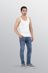 Wall Mural - Side profile of young healthy male model wearing white plain white tank top shirt in blue denim jeans pant. Isolated background
