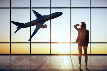 Poster - Businesswoman in modern airport interior