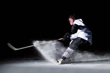 Canvas Print - ice hockey player in action kicking with stick