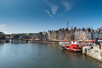 Poster - people enjoying a beautiful summer day in the village of Honfleur in Normandy