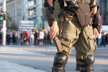 Wall Mural - Armed riot police officer on duty during street protest