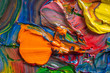 canvas print picture - Different bright colors of oil paints are mixed on a palette close-up.