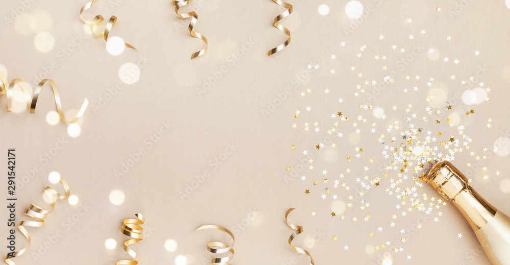 Champagne bottle with confetti stars, bokeh decoration and party streamers on golden background. Christmas, birthday or wedding concept. Flat lay. - obrazy, fototapety, plakaty 