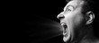 © svetazi - Concept of anger. Portrait of a screaming man on isolated background with free space. Black and white image.