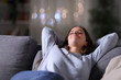 © Antonioguillem - Happy relaxed woman resting at home in the night