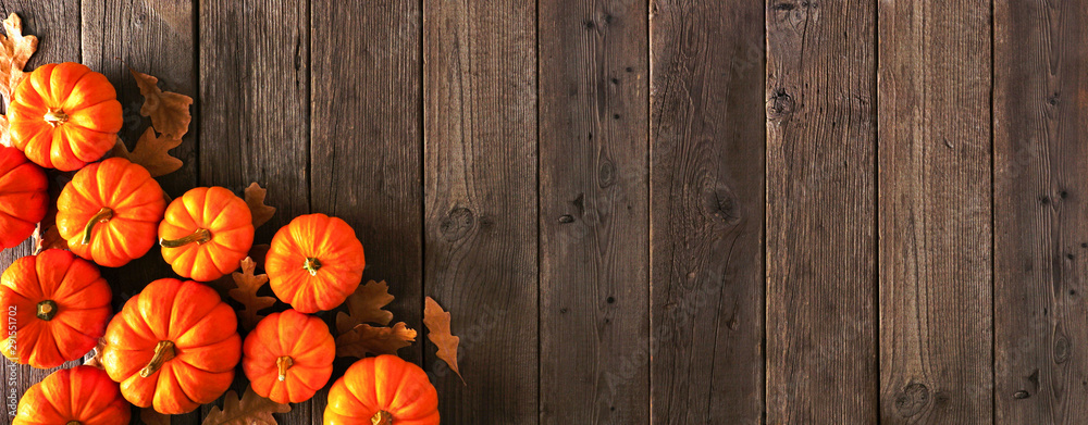 Autumn corner border banner of pumpkins and fall leaves. Top view on a ...
