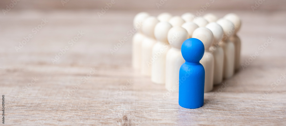 blue leader businessman with crowd of wooden men. leadership, business, team, teamwork and Human resource management concept - obrazy, fototapety, plakaty 