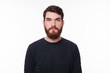 © Vulp - Portrait of serious young man with beard looking at the camera