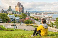 Canada Travel Quebec City Tourist Enjoying View Of Chateau Frontenac Castle And St. Lawrence River In Background. Autumn Traveling Holiday People Lifestyle.