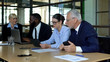 © motortion - Company colleagues discussing news in office, using modern gadgets, teamwork