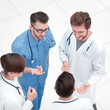 © ASDF - view from the top. team of doctors discussing the problems