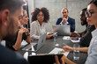 © alphaspirit - Team of business people work together in office. Concept of teamwork and partnership