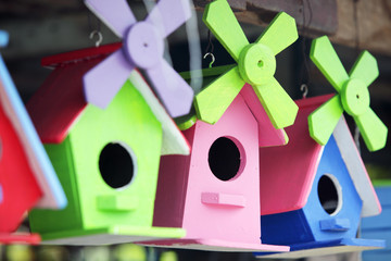 Poster - colorful wooden bird house background.