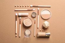Flat Lay Composition With Makeup Brushes On Brown Background