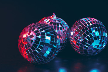 Wall Mural - Group of shiny Disco Balls on dark background close up