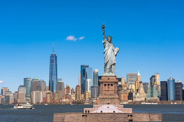 Fototapete - The Statue of Liberty over the New York cityscape river side which location is lower manhattan, United state of America, USA, Architecture and building with tourist concept