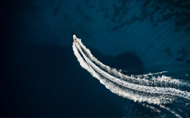 Wall Mural - Speed boat in mediterranean sea, aerial view